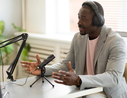 man-being-interviewed-podcast_23-2149029340